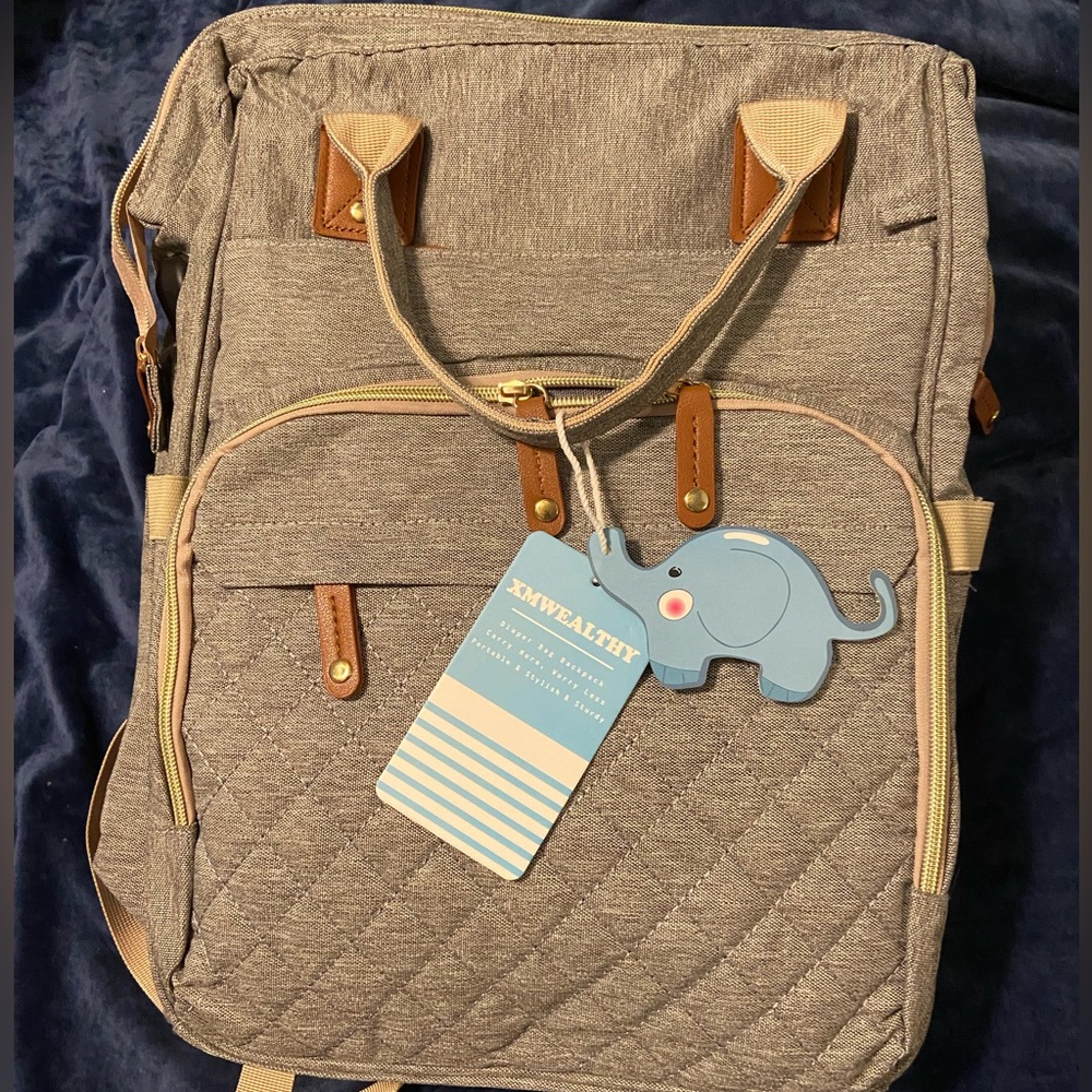 NWT Convertible backpack and diaper bag with bassinet and diaper-changing pad